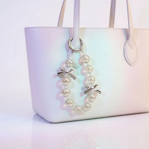 Charm Cristal con Moños Plata Celular Mujer